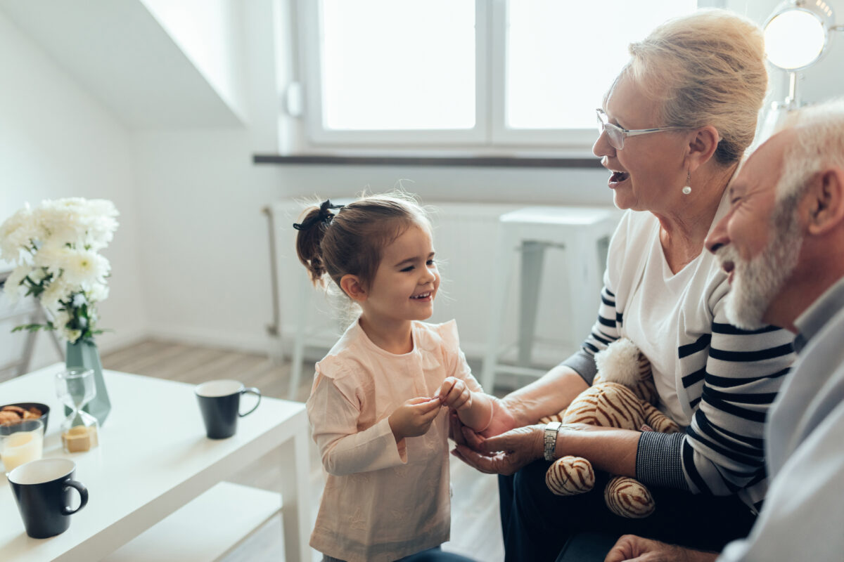 Young girl talking to her grandparents