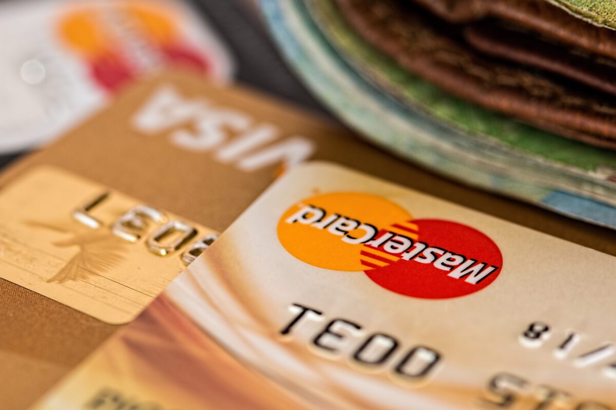 An image featuring several Visa and MasterCard credit cards.