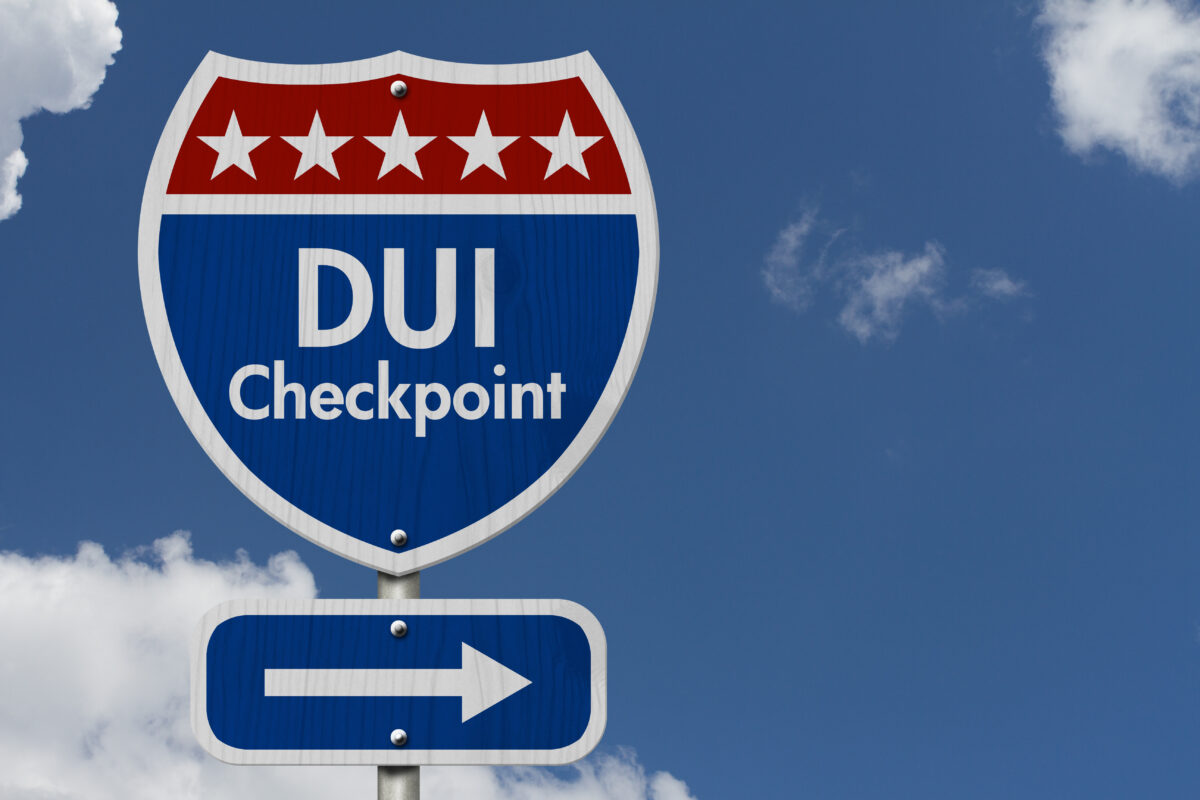 American Highway Sign with words DUI Checkpoint with a sky background