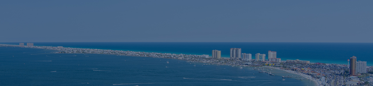 Aerial view of ocean and city buildings